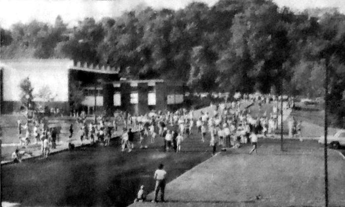 Runners warm up before the start of
the first 3-mile Brookline Breeze run.
