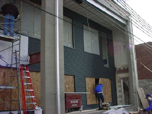 A view from the rear of the building
where the wall has been replaced by
windows. A fire escape and protective
metal grating was installed as well.