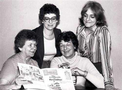 Members of the Brookline Area Community Council in 1982
looking over an informational pamphlet on Brookline.
