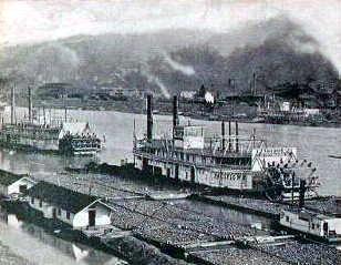 The Mon Wharf cluttered
 with barge traffic waiting for their turn on the river.