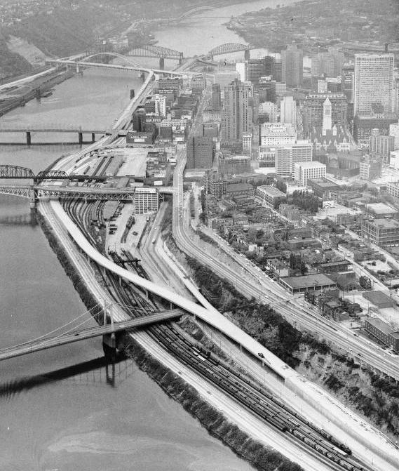 The Penn-Lincoln Parkway upon
completion of the downtown portion
of the roadway. All interchanges
have been completed and all that
remains is to open the Fort Pitt
Bridge to connect the Parkway East
with the Parkway West on the other
side of the Fort Pitt Tunnel.