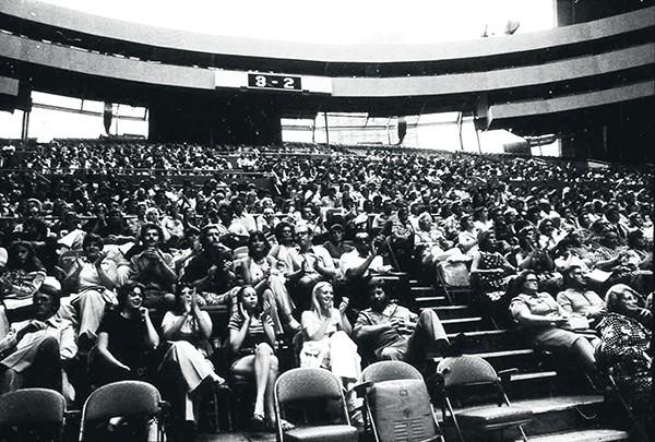 Fans watch a Pittsburgh Triangles tennis match
under the open roof of the Civic Arena in 1975.