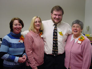 The Brookline staff gets ready for the
ribbon cutting: Peg Murhammer, Ginny Imburgia,
Walt Kimball, and Judy Dinardo.