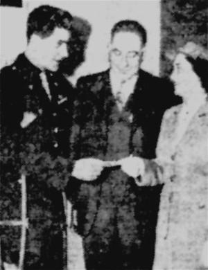 Lt. Frederick E. Streicher, left,
makes a donation to Red Cross.