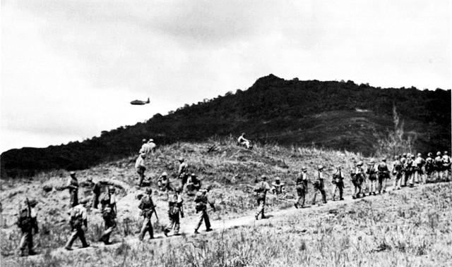 Men of the 3rd Battalion, 4th Marines
advance off the beach at Guam.