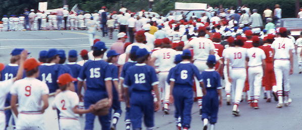 The uniformed throng make their
way past Creedmore Avenue and start down
the hill towards the Community Center.