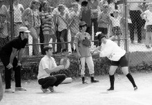 Father Terza and Jack Henry
await the pitch. LL Mom Beverly
Sciulli watches as a Senior mom
takes aim. It was quite a show.