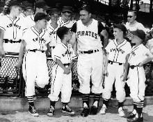 Brookline Little Leaguers gather
around as Pirate skipper Danny Murtaugh
sizes up, and offers some valuable P's
and Q's on the basic fundamentals of the
game of baseball to nine-year old Jackie
Onodi. 