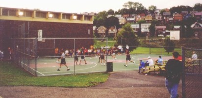 Photo of
 outdoor summer basketball league action.
